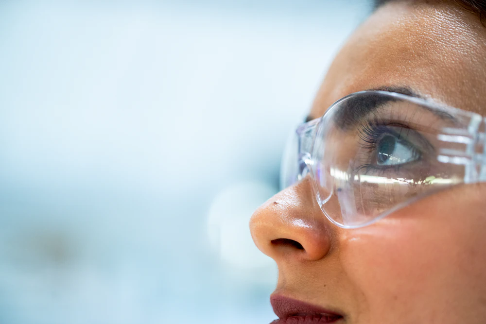 Researcher in safety goggles in the laboratory